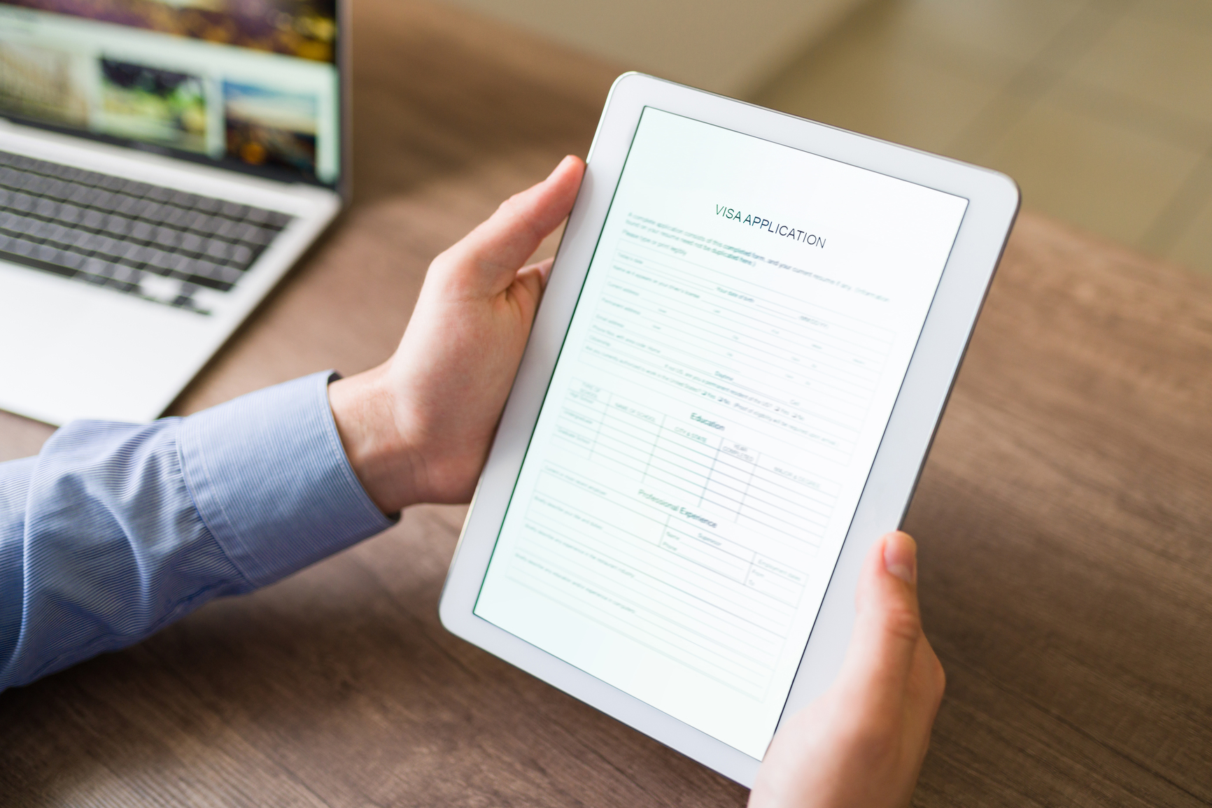 Filling a visa application online on a tablet